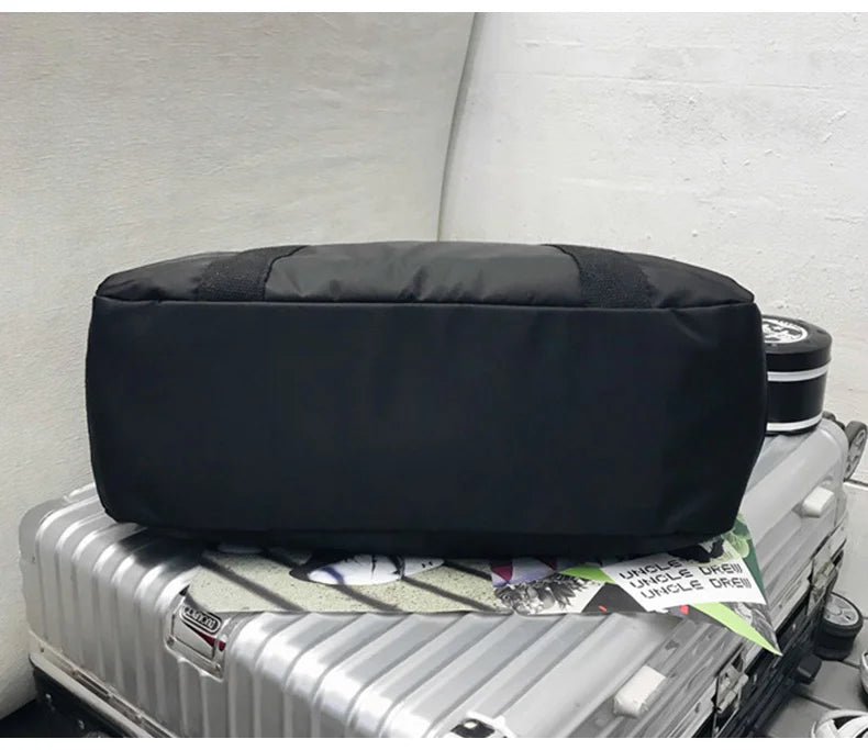 Waterproof nylon gym bag with sturdy handles and detachable shoulder strap - product image